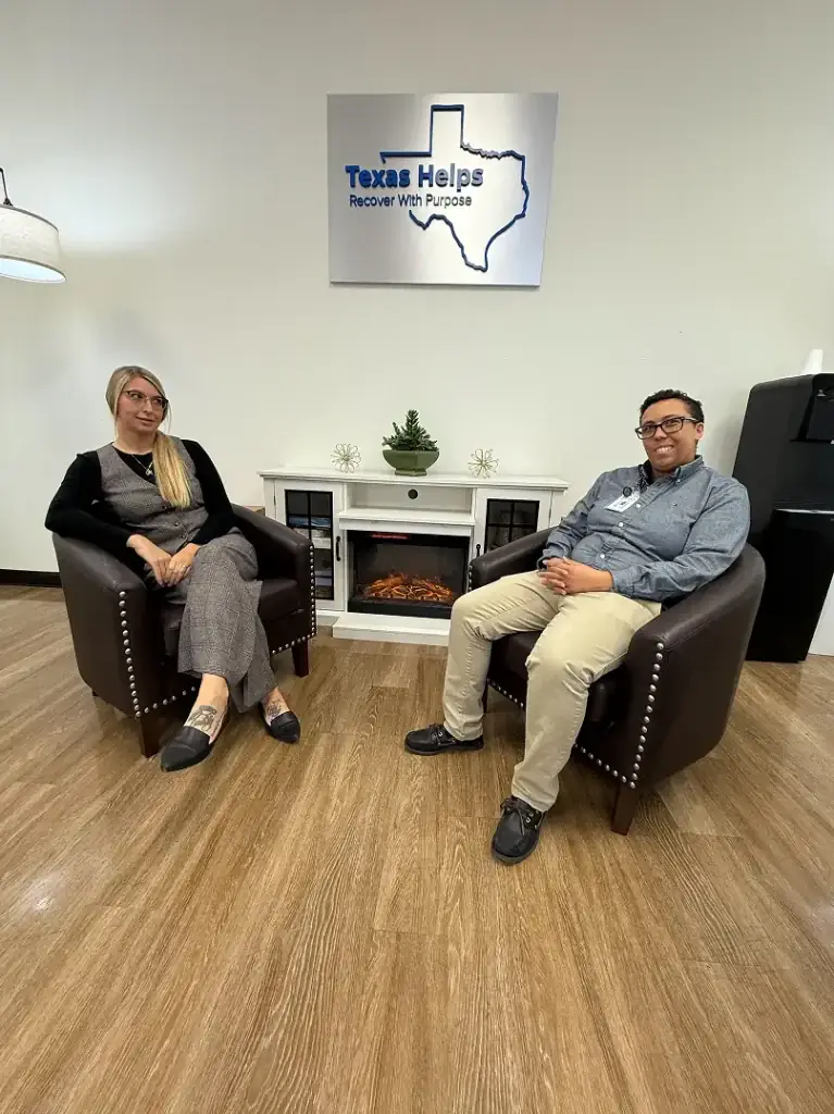 Two Texas Helps staff seated in treatment center lobby