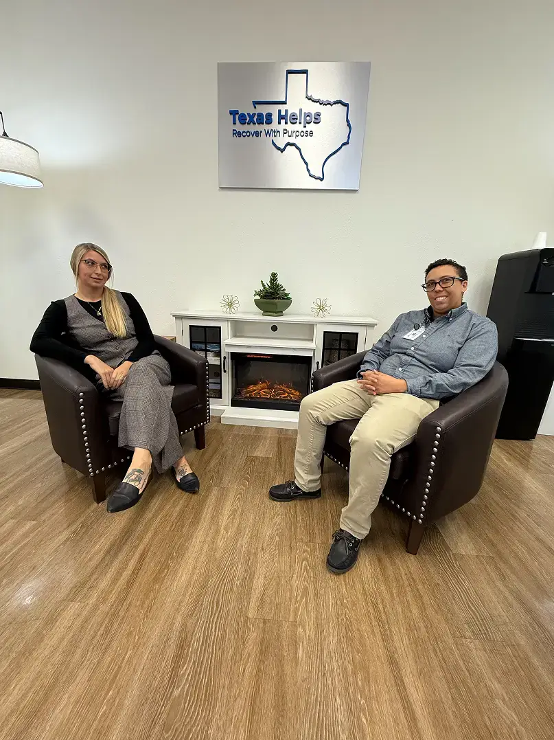 Two Texas Helps staff seated in treatment center lobby