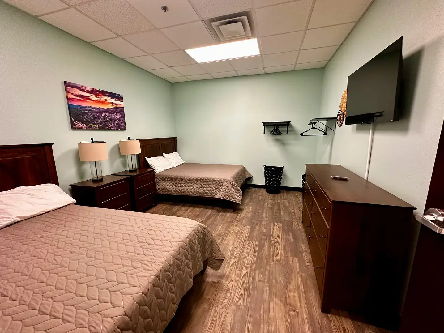 Shared residential bedroom at Texas Helps rehab center with two beds